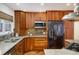 Charming kitchen features wood cabinets, stainless steel appliances, and stone countertops at 1605 17Th St, Boulder, CO 80302