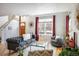 Cozy living room featuring a stylish gray couch, hardwood floors, and a welcoming ambiance at 1605 17Th St, Boulder, CO 80302