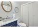 Bathroom features a marble countertop, updated sink, and a framed mirror, offering style at 10001 E Evans Ave # 74C, Aurora, CO 80247