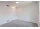 A minimalist bedroom with carpet, a ceiling fan, and a built-in closet for storage at 10001 E Evans Ave # 74C, Aurora, CO 80247