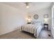 Comfortable bedroom with neutral carpet, ceiling fan, and tasteful decor creates a cozy retreat at 10001 E Evans Ave # 74C, Aurora, CO 80247