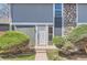 Close-up of the home's front door, showcasing the entry and small garden at 10001 E Evans Ave # 74C, Aurora, CO 80247