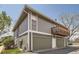 A multi-car garage with above balcony, offering ample parking and outdoor space at 10001 E Evans Ave # 74C, Aurora, CO 80247