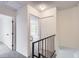 A carpeted hallway with access to bedrooms and a closet, enhancing functionality at 10001 E Evans Ave # 74C, Aurora, CO 80247