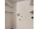 Functional laundry area with utility connections and storage shelves at 10001 E Evans Ave # 74C, Aurora, CO 80247