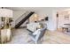 Stylish living area with wood floors, staircase, breakfast bar and modern decor at 10001 E Evans Ave # 74C, Aurora, CO 80247