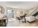 Bright living room with modern furnishings and a sliding glass door to the patio at 10001 E Evans Ave # 74C, Aurora, CO 80247
