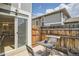 A charming fenced patio with an outdoor dining set, ideal for entertaining at 10001 E Evans Ave # 74C, Aurora, CO 80247