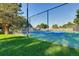 Community tennis court with green and blue surface, surrounded by a fence and lush greenery at 10001 E Evans Ave # 74C, Aurora, CO 80247