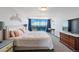 Bright bedroom with large windows, carpet and simple decor at 1155 N Ash St # 1408, Denver, CO 80220