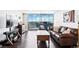 Bright living room featuring hardwood floors, a leather sofa and balcony with city views at 1155 N Ash St # 1408, Denver, CO 80220