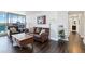 Cozy living room with a leather sofa and a large window showcasing city views at 1155 N Ash St # 1408, Denver, CO 80220