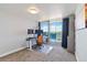 Functional home office with a sit stand desk and balcony at 1155 N Ash St # 1408, Denver, CO 80220