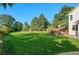 Spacious lawn features a partially covered deck with a hot tub offering many possibilities at 8000 S Williams Way, Centennial, CO 80122