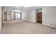 Spacious finished basement area with plush carpeting and multiple entryways, with neutral-colored walls at 8000 S Williams Way, Centennial, CO 80122