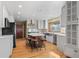 Well-equipped kitchen with an island, stainless steel appliances, ample cabinet space, and hardwood floors at 8000 S Williams Way, Centennial, CO 80122