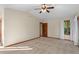 Large main bedroom with plush carpet, a ceiling fan and bright windows with views of the neighborhood at 8000 S Williams Way, Centennial, CO 80122