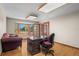 Bright home office featuring hardwood floors, a bay window, and access to an outdoor space through glass paneled doors at 8000 S Williams Way, Centennial, CO 80122