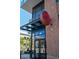 Exterior view of Dos Santos restaurant entrance with large signage, and patio seating at 20 Wilcox St # 309, Castle Rock, CO 80104