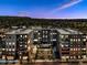 Stunning multi-story condominium building with mountain views at sunset and lush landscaping at 20 Wilcox St # 309, Castle Rock, CO 80104
