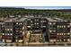 Contemporary condo building featuring outdoor pool, courtyard, and first floor retail shops at 20 Wilcox St # 309, Castle Rock, CO 80104
