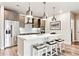 Modern kitchen with stainless steel appliances, white countertops, and pendant lighting at 20 Wilcox St # 309, Castle Rock, CO 80104