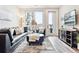 Comfortable living room with modern decor, lots of light, and views of the city at 20 Wilcox St # 309, Castle Rock, CO 80104