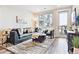 Cozy living room with large windows, stylish furnishings, and a neutral color palette at 20 Wilcox St # 309, Castle Rock, CO 80104