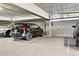 Reserved parking spot in a covered parking garage with concrete ceiling and brick wall at 20 Wilcox St # 309, Castle Rock, CO 80104
