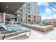 Relaxing pool deck with lounge chairs and a spa, overlooking the city at 20 Wilcox St # 309, Castle Rock, CO 80104