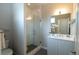 Modern bathroom with glass-enclosed shower, stylish vanity, and elegant finishes at 1355 Zenobia St, Denver, CO 80204