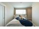 Comfortable bedroom featuring a large window with natural light and a cozy bed at 1355 Zenobia St, Denver, CO 80204