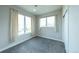 Bright bedroom with large windows, soft carpet, and neutral walls at 1355 Zenobia St, Denver, CO 80204