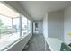 Bright, neutral hallway with plush carpet leading to a deck with views at 1355 Zenobia St, Denver, CO 80204