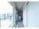 Hallway leading to deck featuring sliding door and lots of natural light at 1355 Zenobia St, Denver, CO 80204