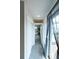 Hallway leading to the deck, with a view to the office and lots of natural light at 1355 Zenobia St, Denver, CO 80204