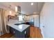 Contemporary kitchen with a center island, stainless steel appliances, and plenty of counter space at 1355 Zenobia St, Denver, CO 80204