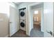 Stacked washer and dryer in a hallway closet, conveniently located near a bathroom at 1355 Zenobia St, Denver, CO 80204