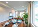 Open living area with wood floors, a dining table, and a glimpse of the cozy living room at 1355 Zenobia St, Denver, CO 80204