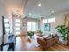 Bright living room featuring wood floors, modern furniture, and a large window at 1355 Zenobia St, Denver, CO 80204