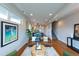 Spacious living room with wood floors, comfortable seating, and a staircase at 1355 Zenobia St, Denver, CO 80204
