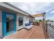 Inviting rooftop deck with lounge seating, a pergola, and neighborhood views at 1355 Zenobia St, Denver, CO 80204