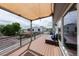 Expansive rooftop deck featuring lounge seating, privacy pergola, and cityscape views at 1355 Zenobia St, Denver, CO 80204
