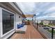 Relaxing rooftop deck with lounge seating, privacy features, and open sky at 1355 Zenobia St, Denver, CO 80204