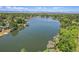 Scenic aerial image of a serene lake surrounded by lush greenery and waterfront properties at 3354 W Arlington Ave, Littleton, CO 80123