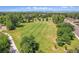 Picturesque aerial shot of a well-maintained park and green space with mature trees and walking paths at 3354 W Arlington Ave, Littleton, CO 80123