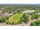 Expansive aerial view showcasing a lush park, tranquil lake, and surrounding residential neighborhood at 3354 W Arlington Ave, Littleton, CO 80123