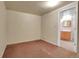Bedroom with neutral carpet and adjacent bathroom at 3354 W Arlington Ave, Littleton, CO 80123