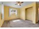 Bedroom with one window, a ceiling fan, and tan carpet at 3354 W Arlington Ave, Littleton, CO 80123