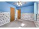 Bedroom with blue walls and carpeted floor features two closet doors at 3354 W Arlington Ave, Littleton, CO 80123